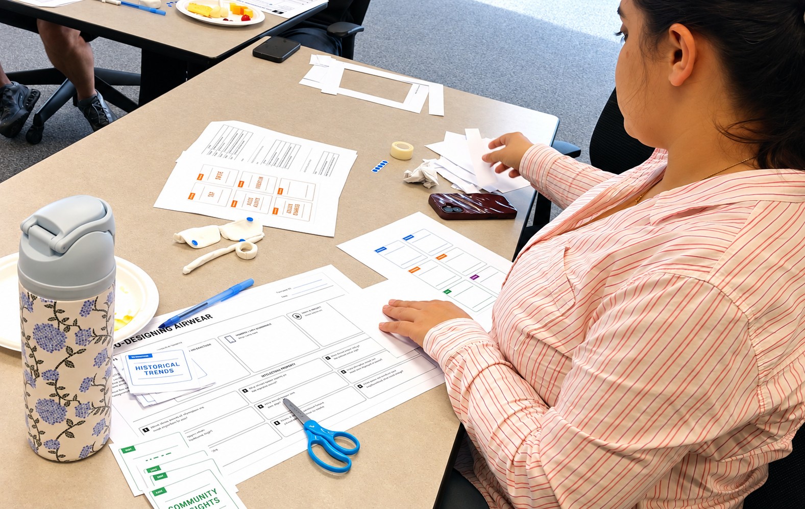 Participants completing individual reflection and design activities during the workshop