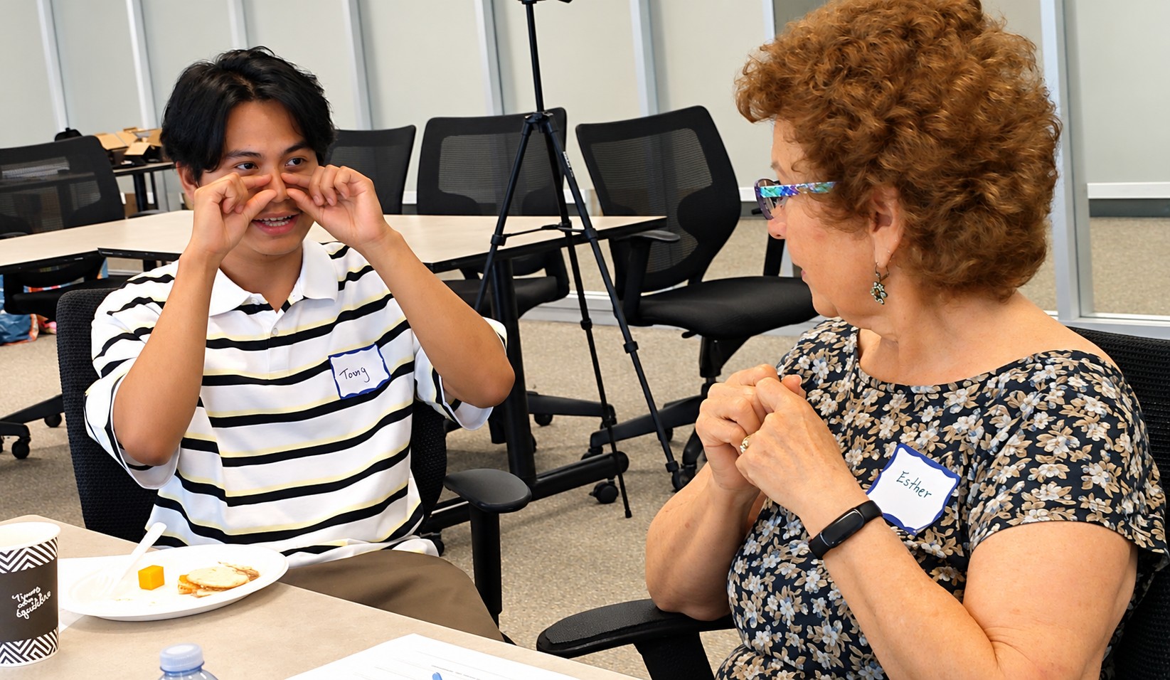 Workshop participants demonstrating and discussing ideas for wearable AirWear devices